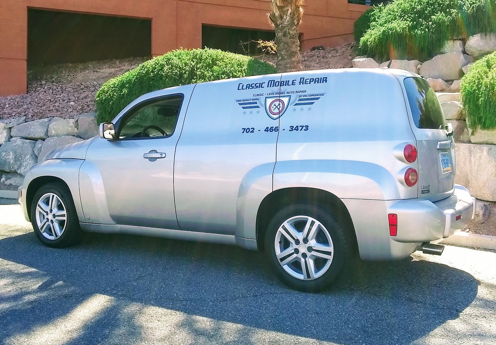 Silver Chevrolet HHR panel van branded Classic Mobile Repair with phone number